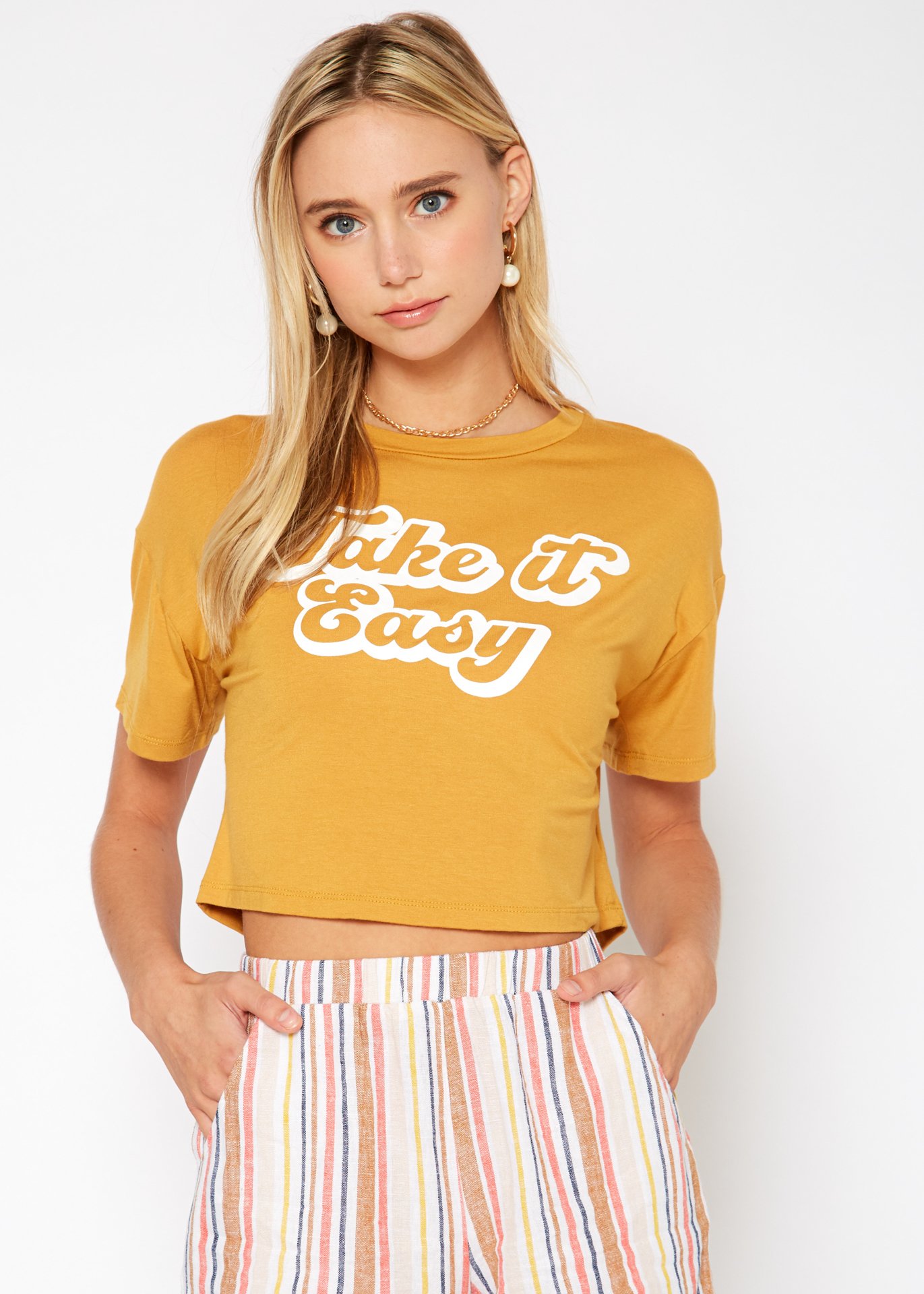 Women's 'Take it Easy' Printed Crop Top featuring a round neck and short sleeves, made from a soft rayon and spandex blend.