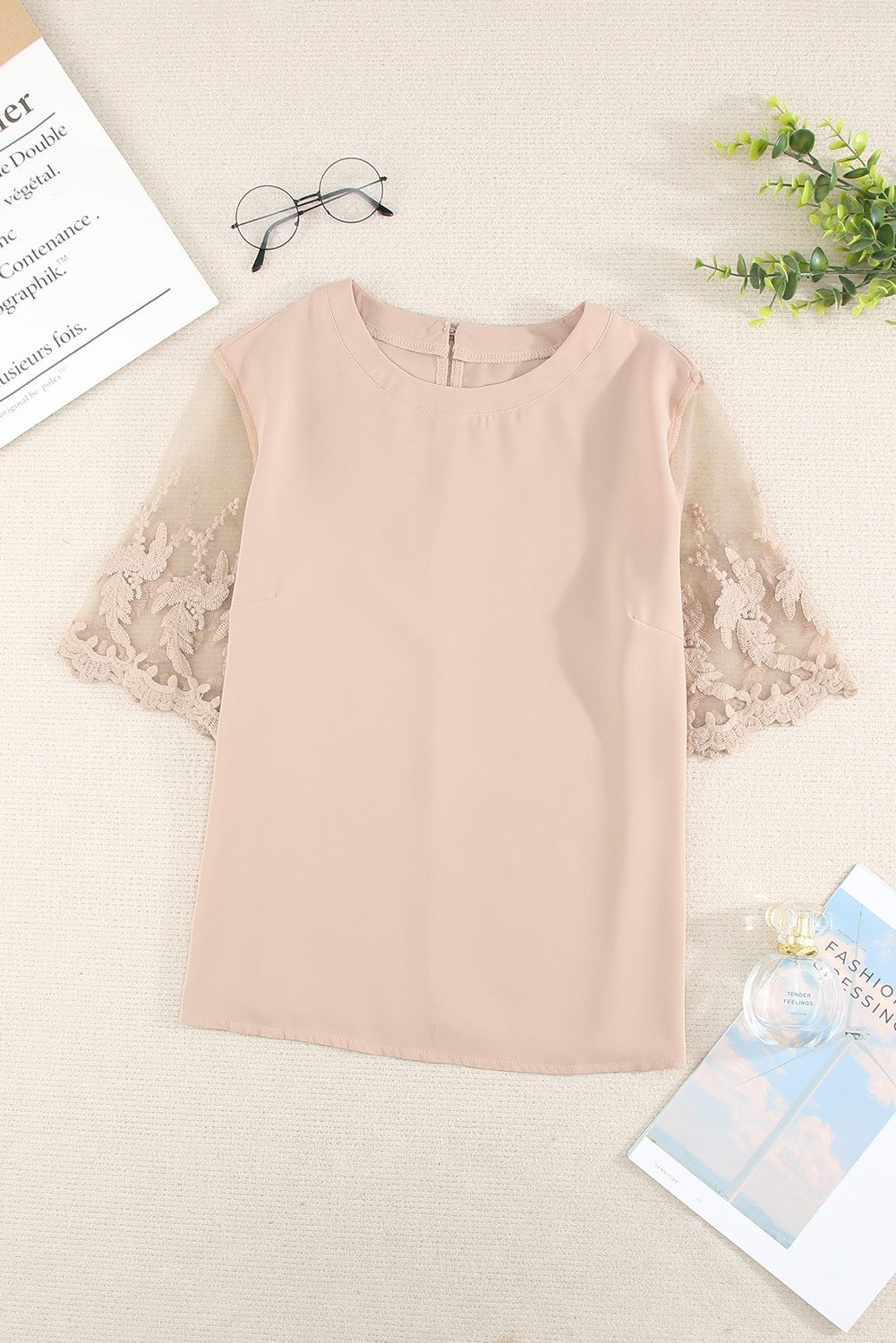 Women's apricot T-shirt with transparent lace sleeves, featuring a loose fit and round collar, perfect for casual and elegant wear.