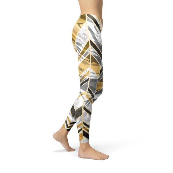 Women's white marble leggings featuring black gold lines, designed for comfort and performance during workouts.