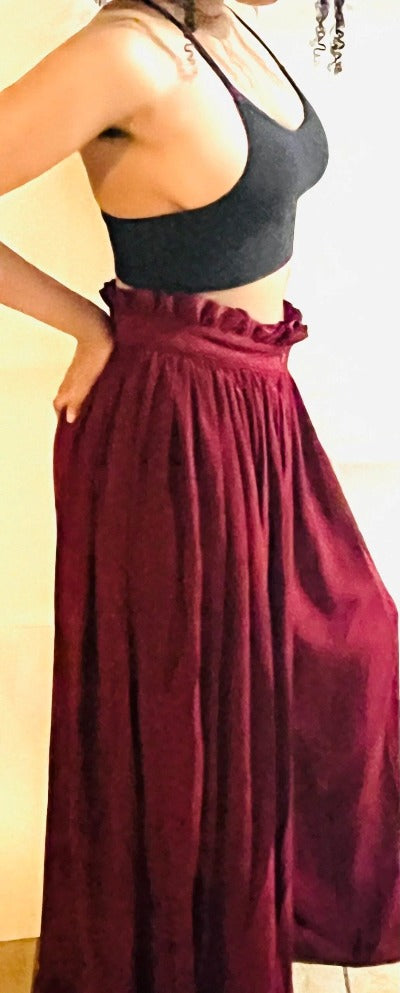 A pair of stylish Women's Wide Leg Palazzo Pants in Burgundy, featuring a pleated front and zipper, perfect for various occasions.