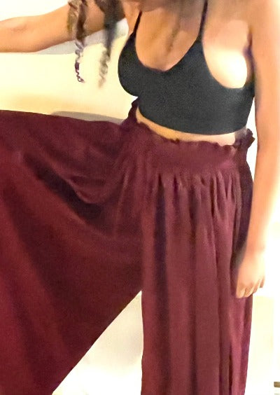 A pair of stylish Women's Wide Leg Palazzo Pants in Burgundy, featuring a pleated front and zipper, perfect for various occasions.