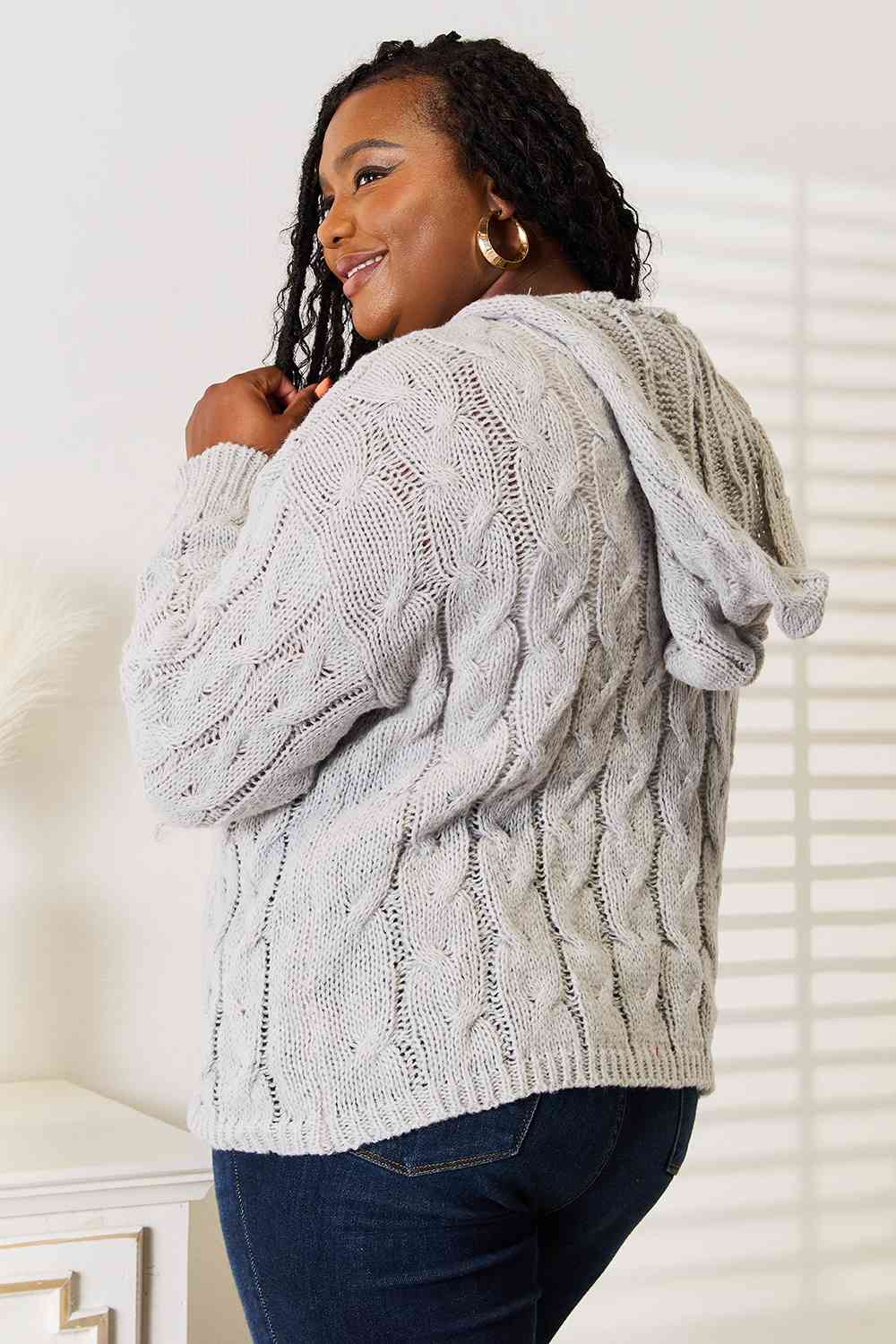 Woven Right Cable-Knit Hooded Sweater in a cozy design, featuring intricate cable-knit patterns and a warm hood.