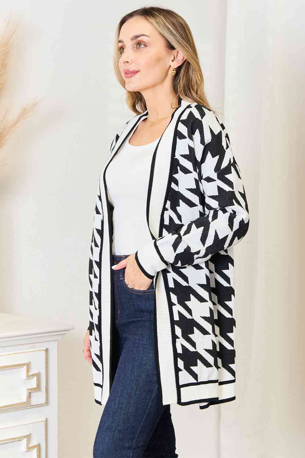 Woven Right Houndstooth Open Front Longline Cardigan displayed on a mannequin, showcasing its elegant design and classic pattern.