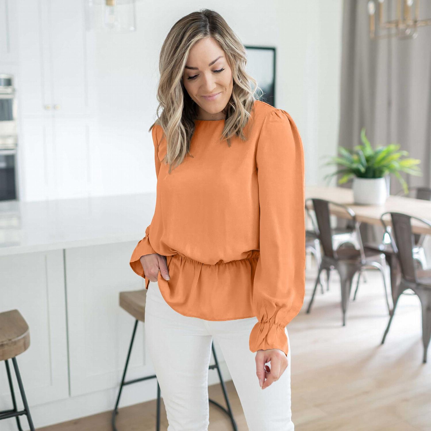 Woven Wool Peach Puff Sleeve Blouse showcasing pleated ruffle design and elastic waistband, perfect for casual or office wear.