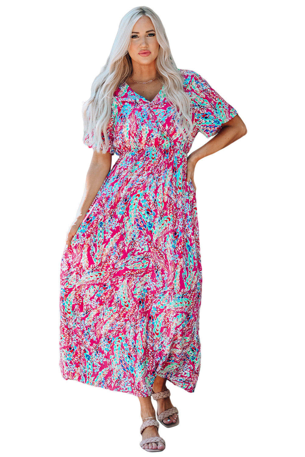 A beautiful woman wearing a Wrap V Neck Floral Maxi Dress with a vibrant floral print, flutter sleeves, and a flattering silhouette, perfect for summer occasions.