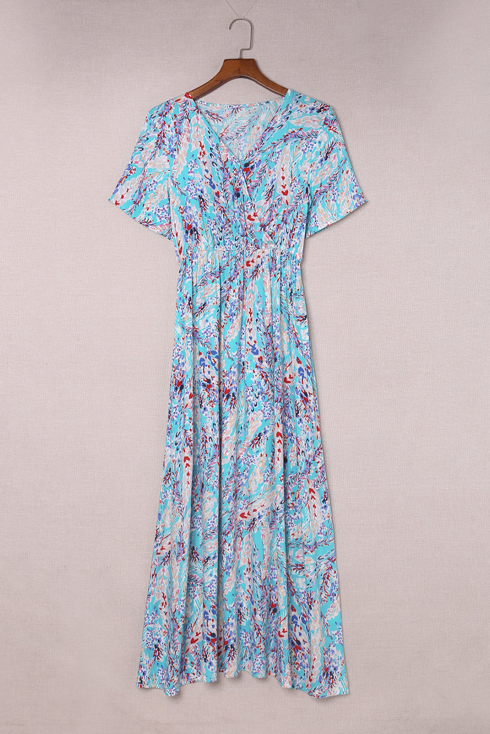 A stylish Wrap V Neck Floral Maxi Dress featuring a vibrant floral print, flutter sleeves, and a flattering wrap design, perfect for summer occasions.