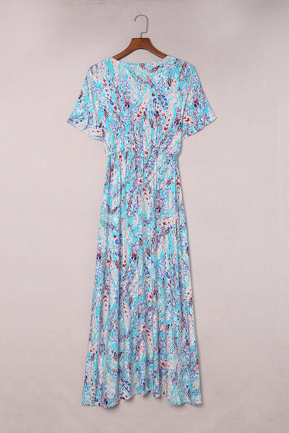 A stylish Wrap V Neck Floral Maxi Dress featuring a vibrant floral print, flutter sleeves, and a flattering wrap design, perfect for summer occasions.