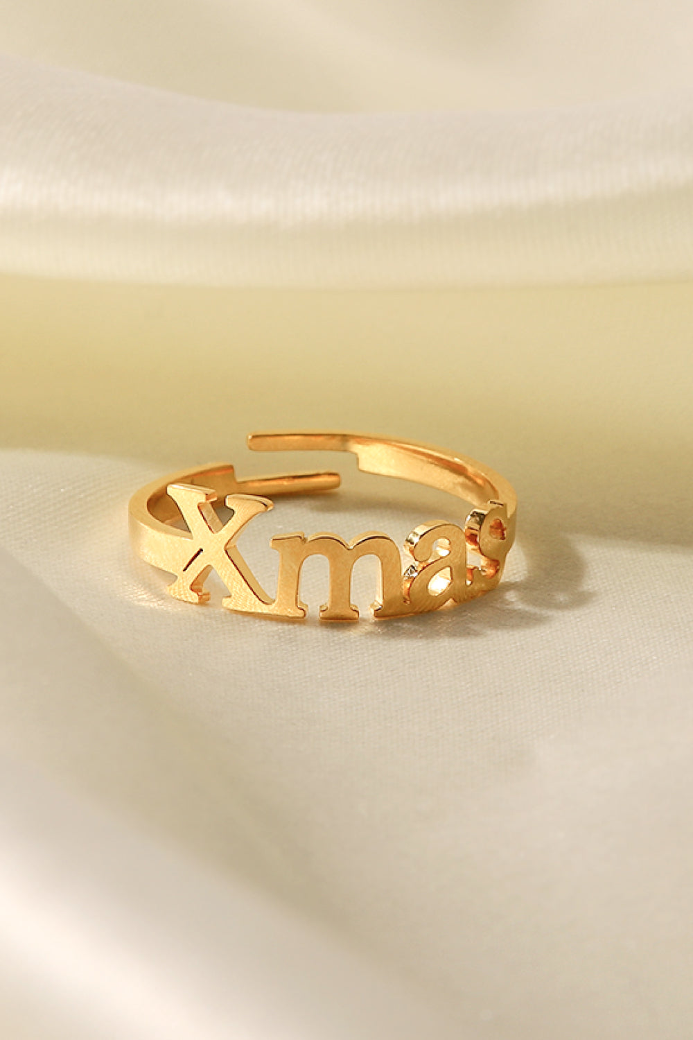 XMAS Letter Stainless Steel Ring with polished finish, showcasing its elegant design and festive motif.