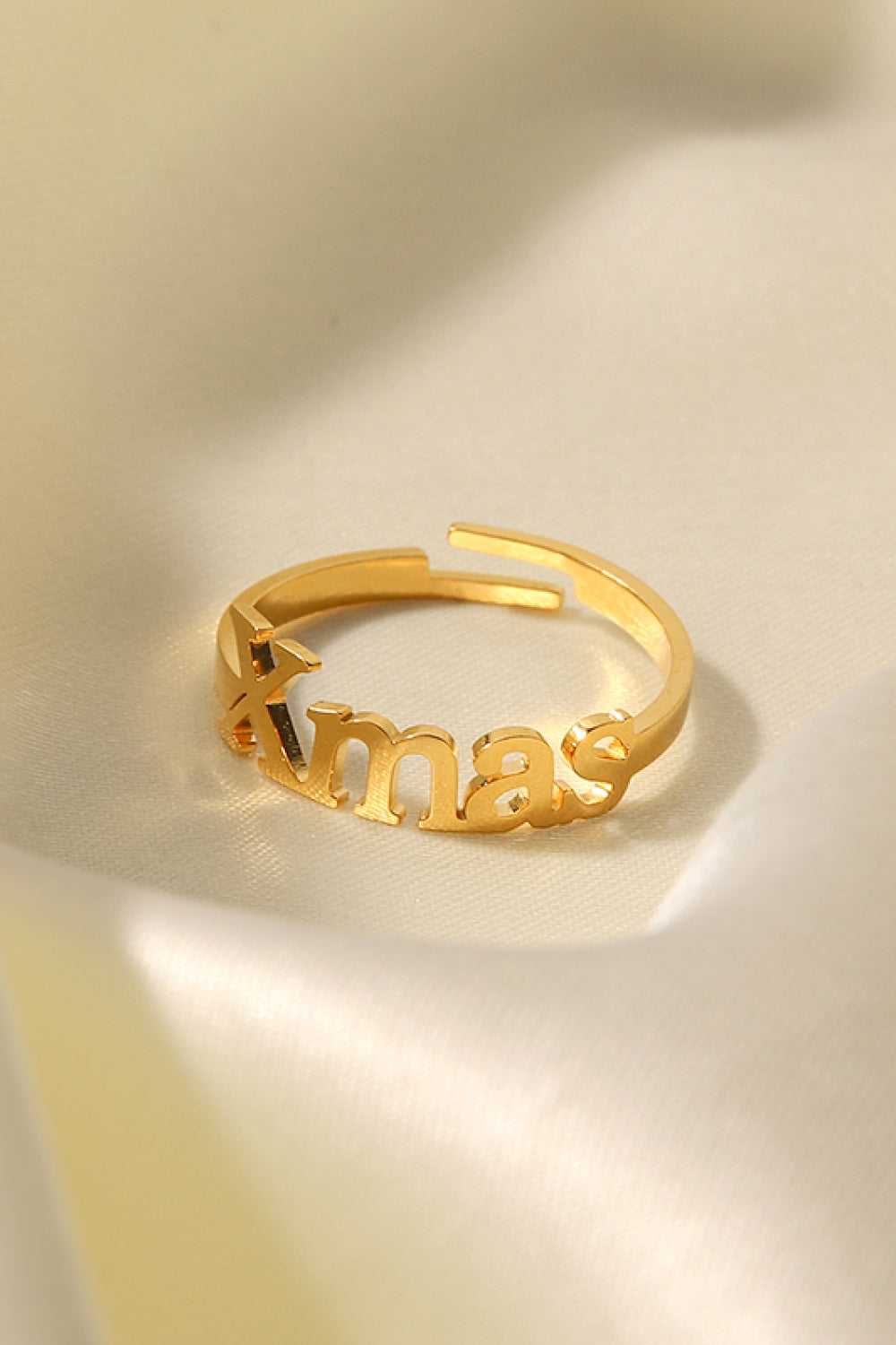 XMAS Letter Stainless Steel Ring with polished finish, showcasing its elegant design and festive motif.