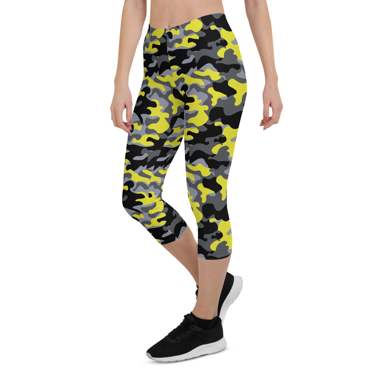 A pair of women's yellow and gray camo capri leggings, showcasing a unique design and high-quality fabric suitable for workouts.