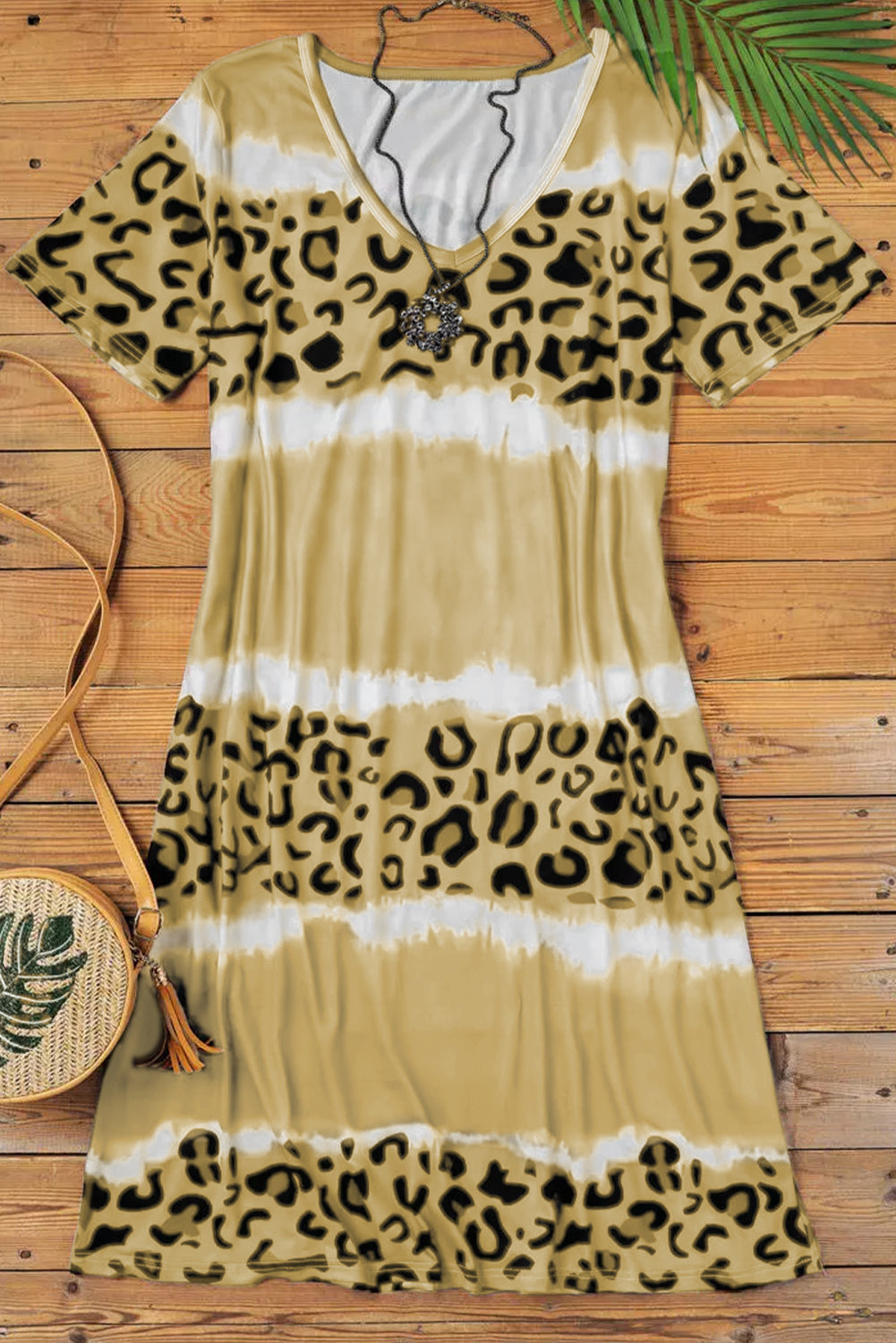 Yellow Leopard Color Block V-Neck T-shirt Dress featuring a vibrant tie-dye and leopard print pattern, short sleeves, and an A-line silhouette.