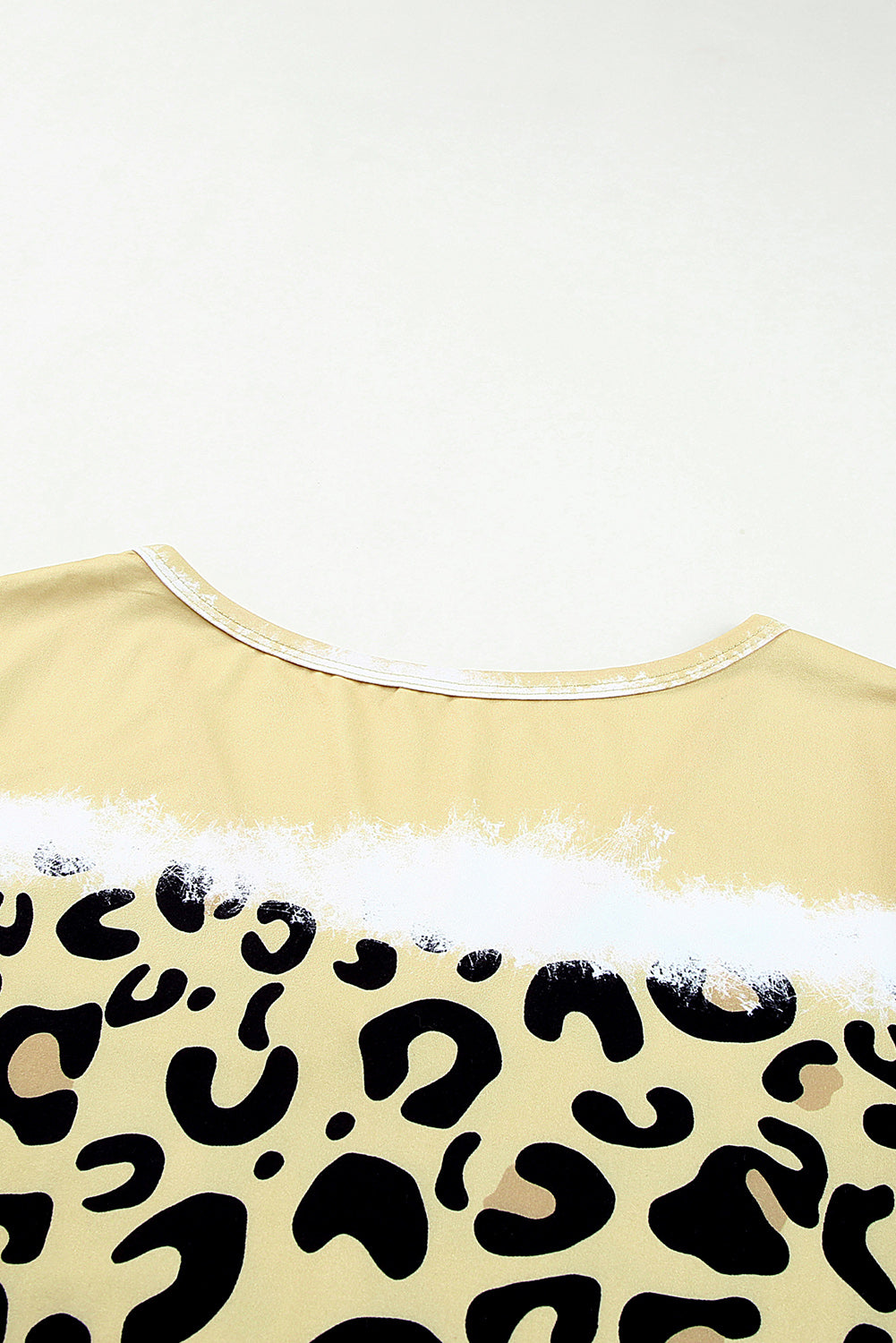 Yellow Leopard Color Block V-Neck T-shirt Dress featuring a vibrant tie-dye and leopard print pattern, short sleeves, and an A-line silhouette.