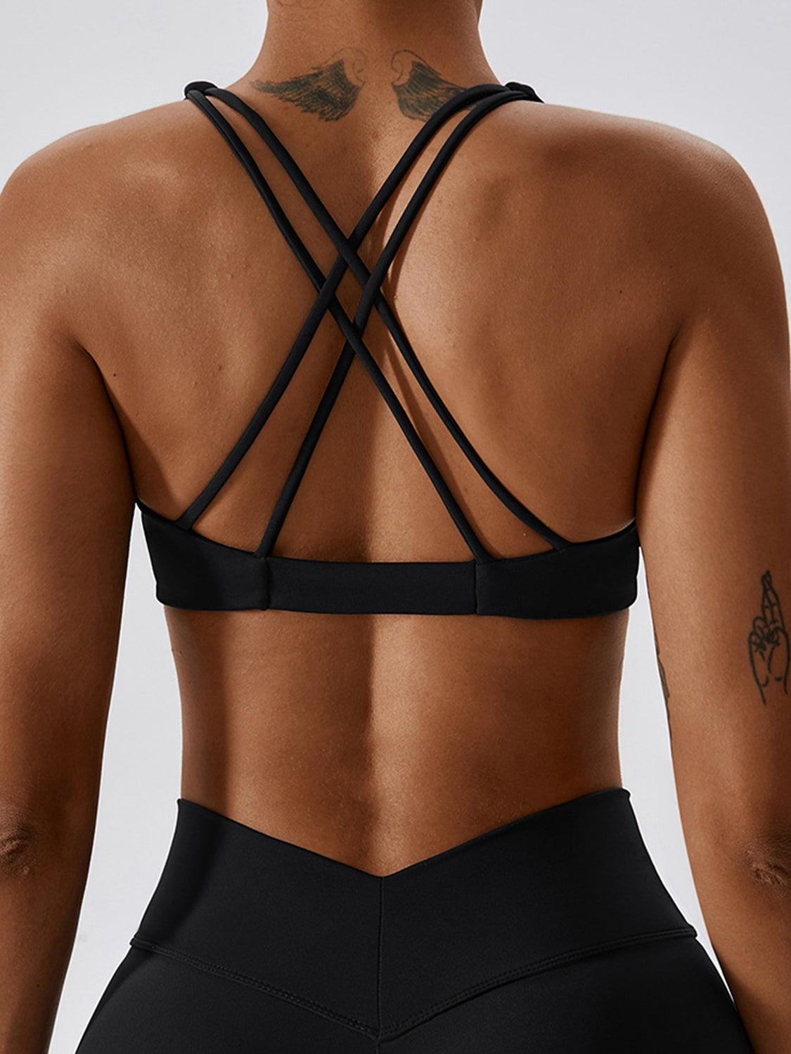 Yoga V-Neck Twisted Sleeveless Sports Bra in solid color, showcasing its sporty design and twisted detail.