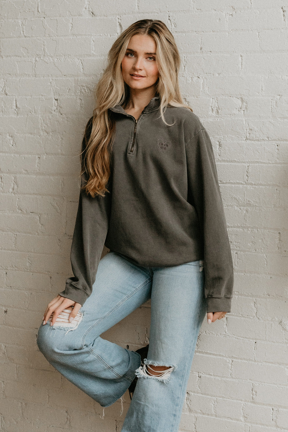 You Are Loved Half Zip Sweatshirt in coral color with heart embroidery on the left chest, showcasing a stylish half zip design.