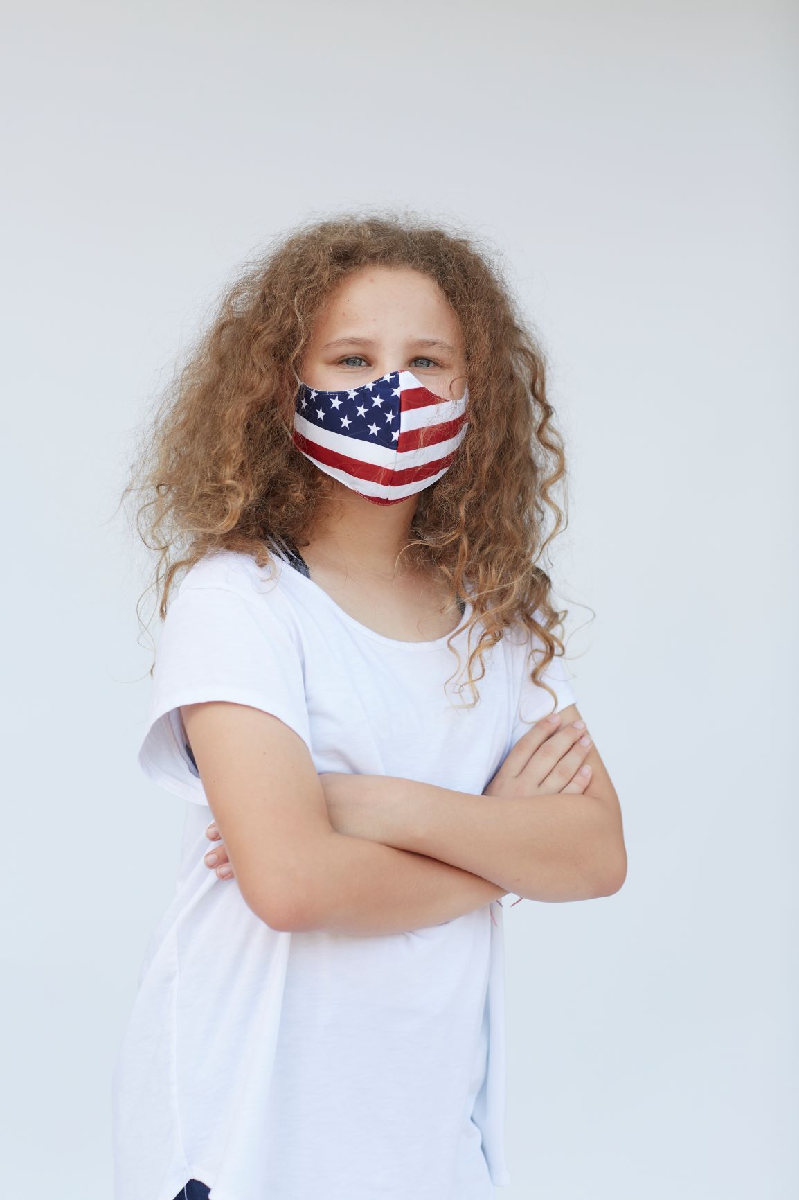 Youth American Flag Face Mask featuring a vibrant design with the American flag, made of breathable materials for comfort.