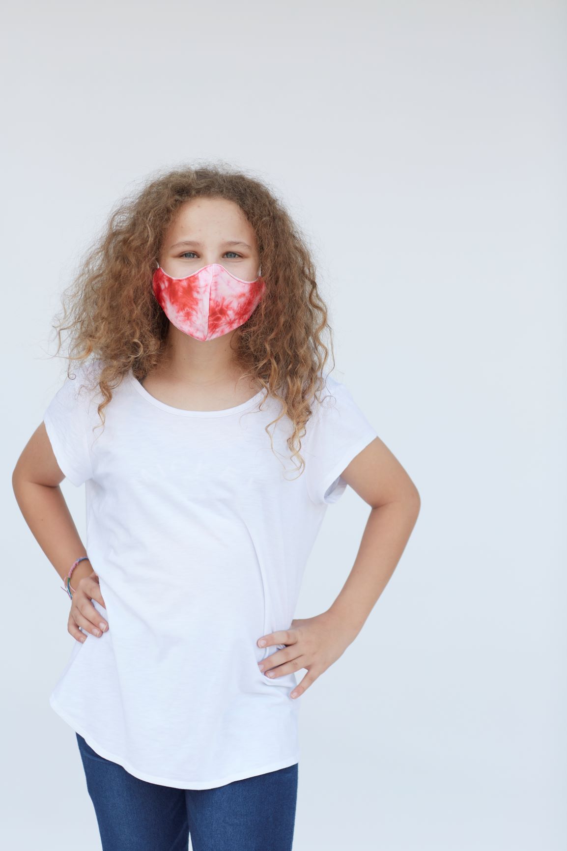 Youth Pink Tie Dye Face Mask featuring a vibrant pink tie-dye pattern, designed for comfort and style.