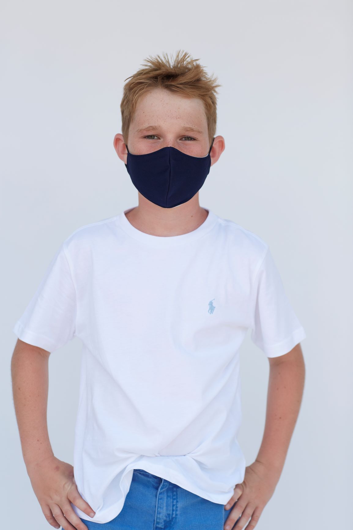 Youth Solid Dark Navy Face Mask showcasing its 3-layer design and filter pocket feature.