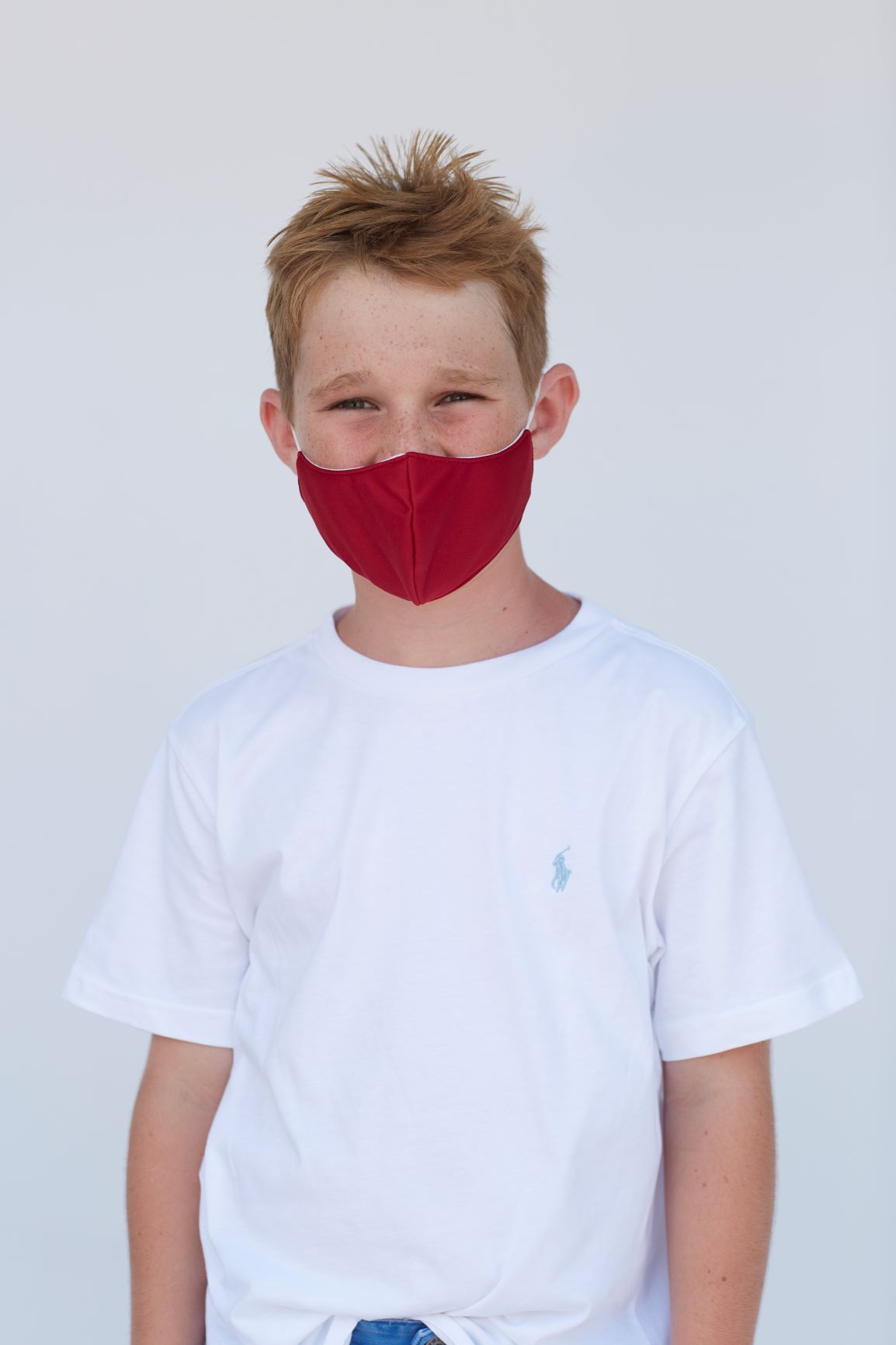 Youth Solid Deep Red Face Mask showcasing its three-layer design and vibrant color.