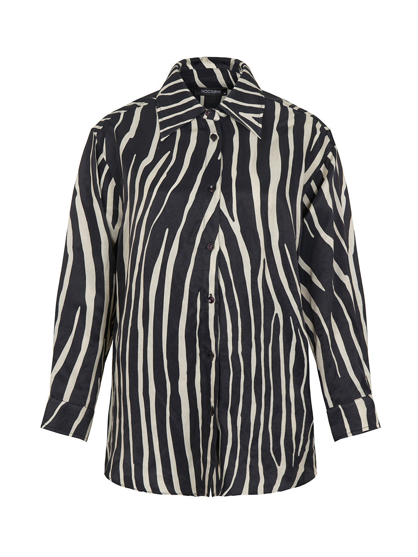 Zebra Print Oversized Linen Shirt featuring a stylish lapel collar and long sleeves with buttoned cuffs in black, white, and purple colors.