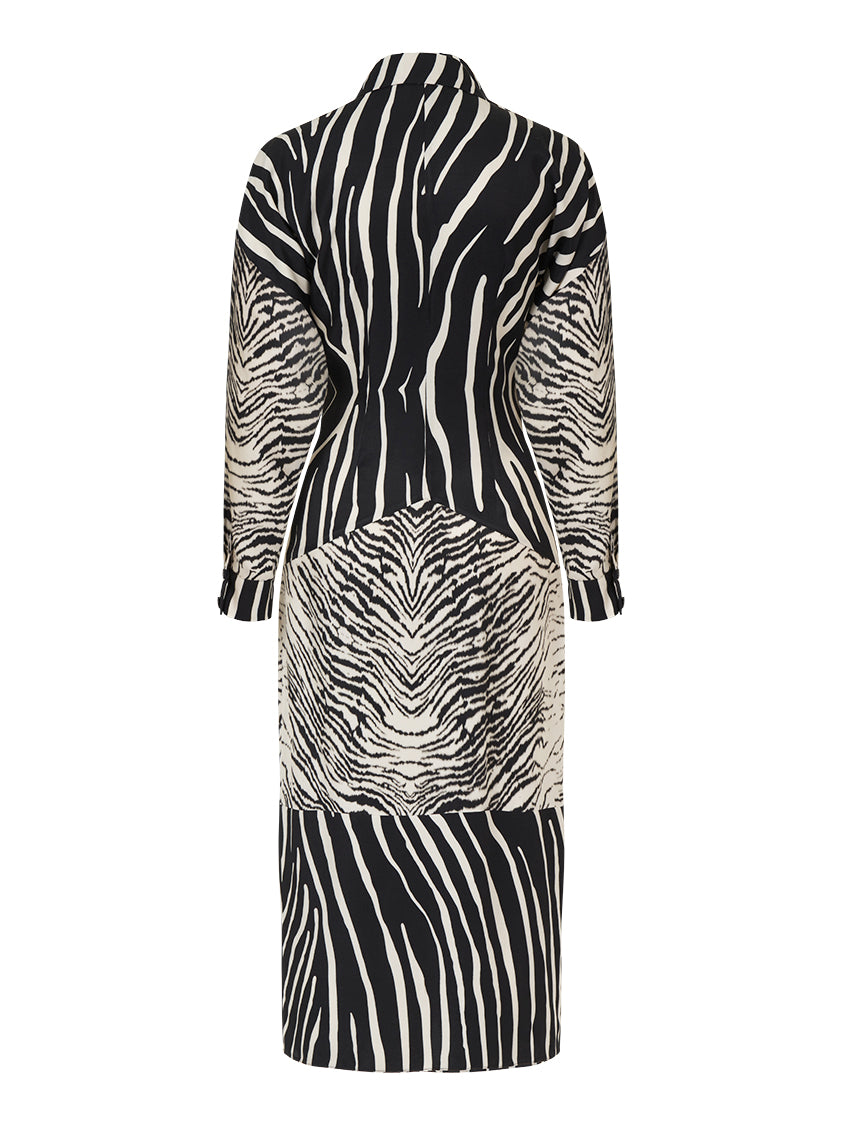 A stylish zebra print shirt dress featuring long batwing sleeves, front button closure, and slit cuffs, perfect for urban chic fashion.