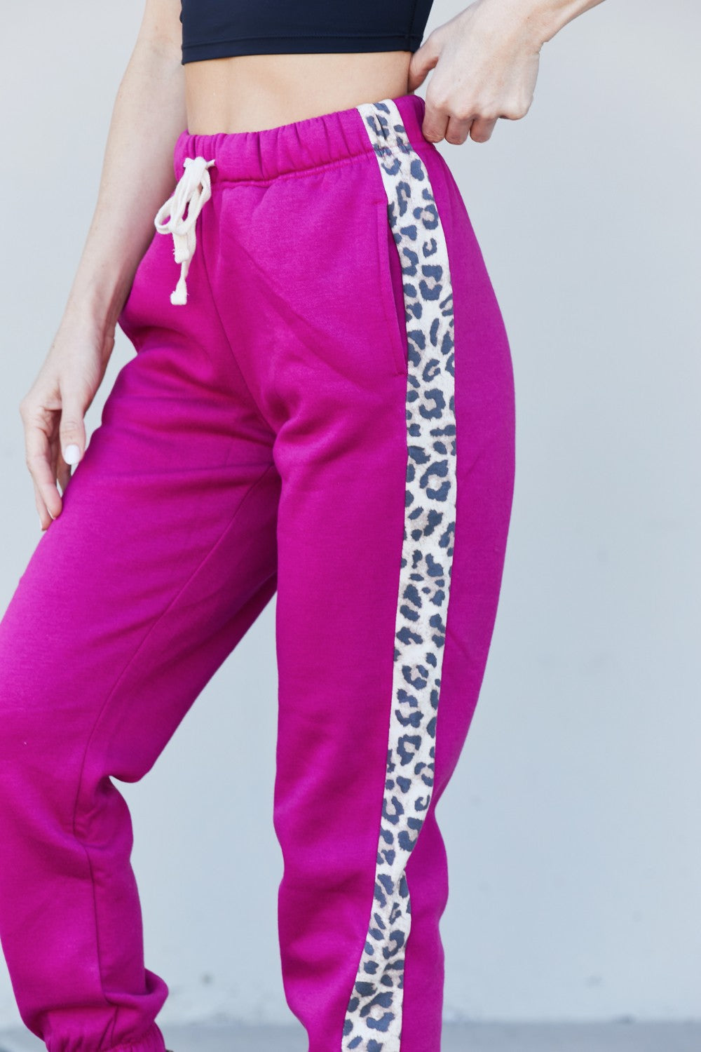 Zenana Animal Lover Full Size Leopard Panel Joggers in Magenta featuring a drawstring waist and side pockets, perfect for casual wear.