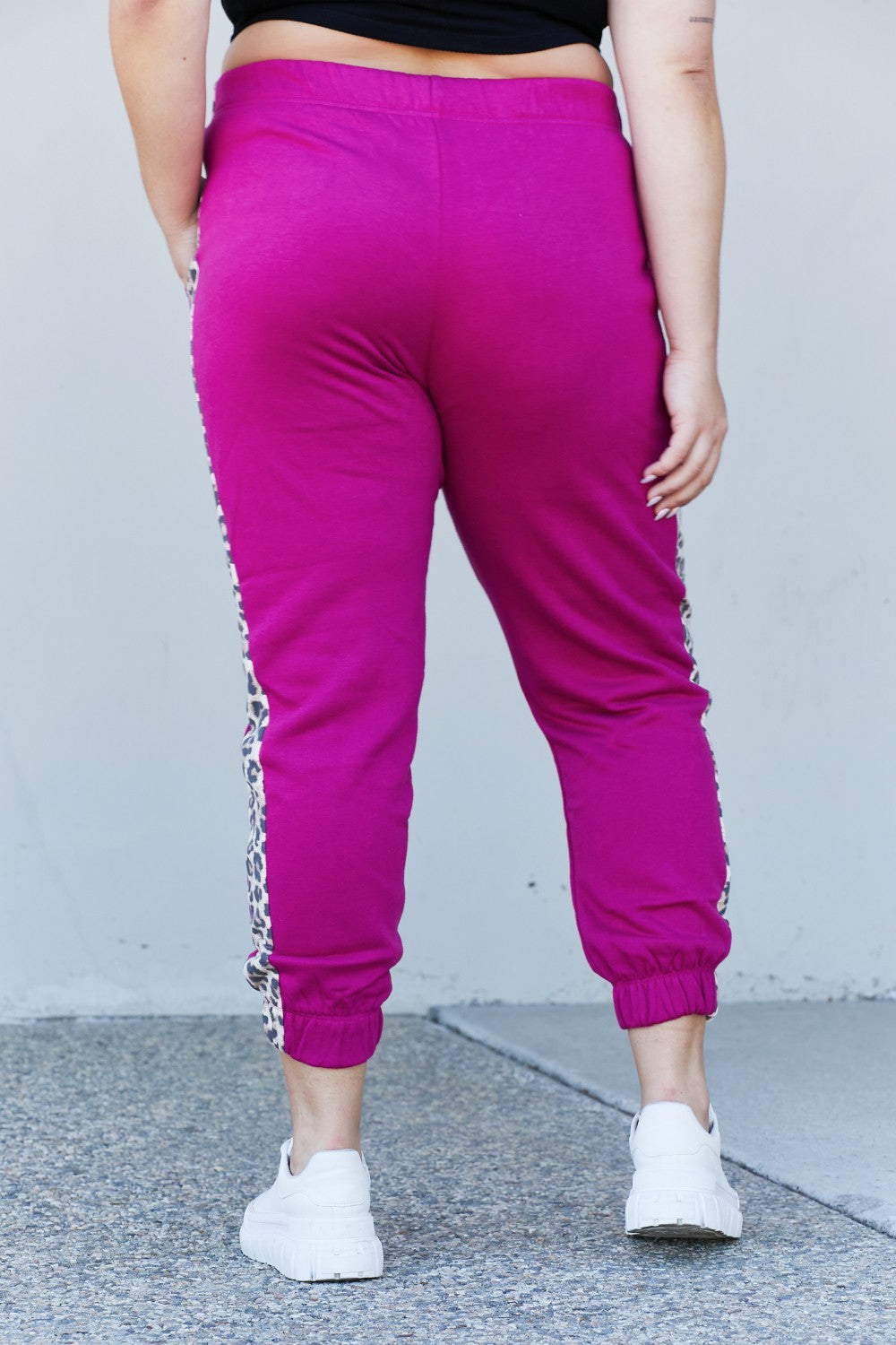 Zenana Animal Lover Full Size Leopard Panel Joggers in Magenta featuring a drawstring waist and side pockets, perfect for casual wear.