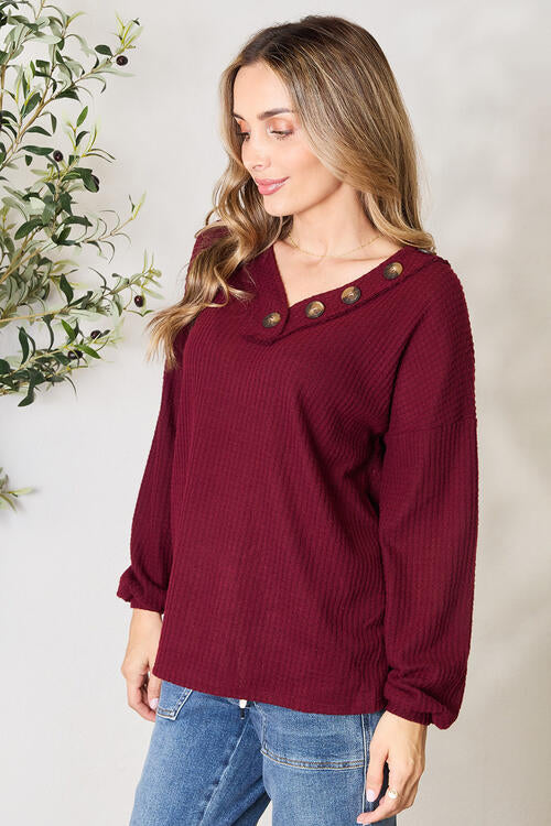 Zenana Buttoned V-Neck Long Sleeve Blouse in luxurious brushed waffle texture, featuring elegant V-neck and unique button detailing.