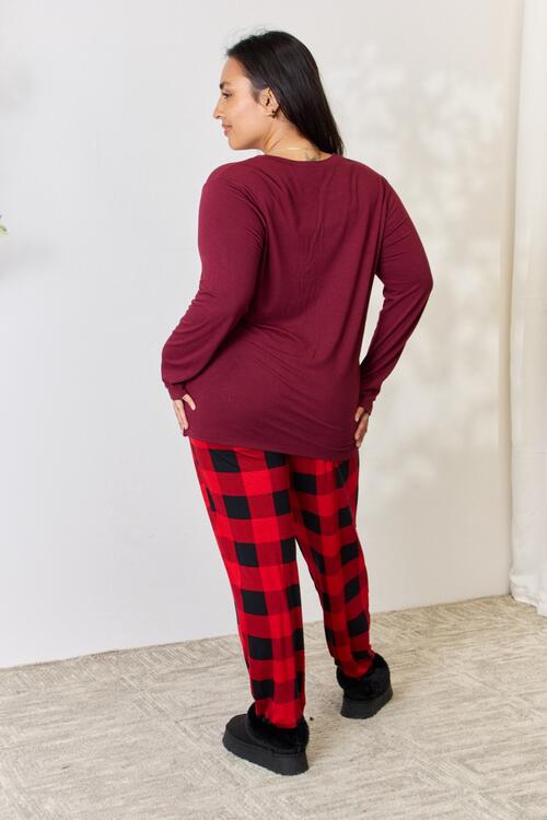 Zenana Full Size Plaid Round Neck Top and Pants Pajama Set featuring a stylish plaid design, front pocket, and drawstring elastic waist pants.