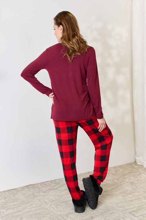 Zenana Full Size Plaid Round Neck Top and Pants Pajama Set featuring a stylish plaid design, front pocket, and drawstring elastic waist pants.