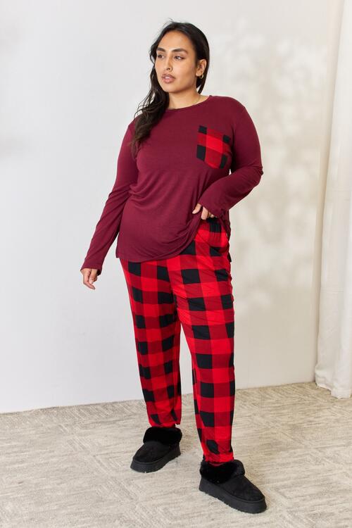 Zenana Full Size Plaid Round Neck Top and Pants Pajama Set featuring a stylish plaid design, front pocket, and drawstring elastic waist pants.