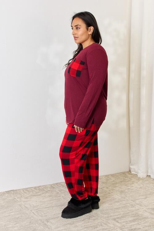 Zenana Full Size Plaid Round Neck Top and Pants Pajama Set featuring a stylish plaid design, front pocket, and drawstring elastic waist pants.