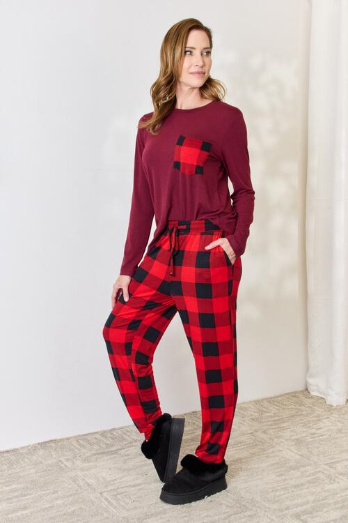 Zenana Full Size Plaid Round Neck Top and Pants Pajama Set featuring a stylish plaid design, front pocket, and drawstring elastic waist pants.