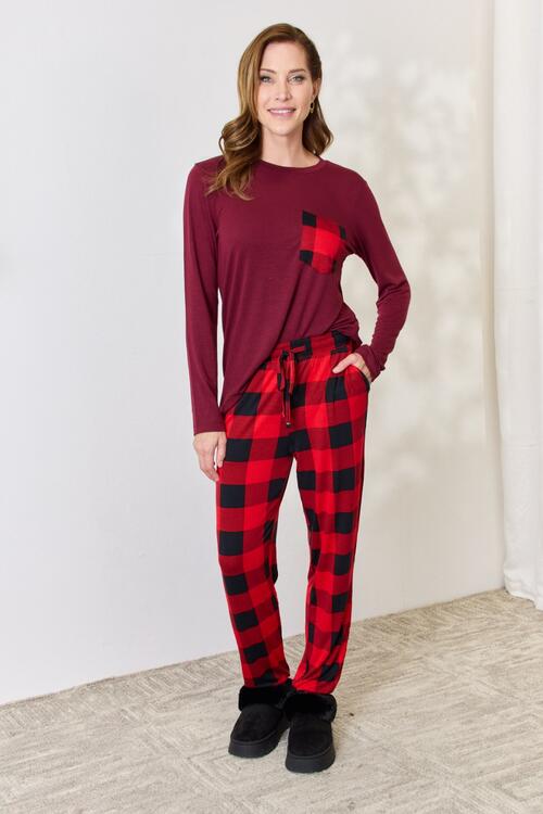 Zenana Full Size Plaid Round Neck Top and Pants Pajama Set featuring a stylish plaid design, front pocket, and drawstring elastic waist pants.