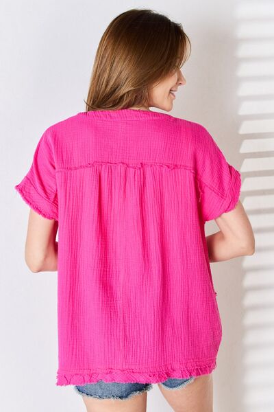 Zenana Full Size Raw Hem Short Sleeve Top in a casual setting, showcasing its unique raw hem and stylish design.