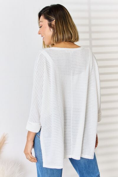 Zenana Full Size Waffle Knit V-Neck Long Sleeve Slit Top in a stylish waffle knit texture, featuring a feminine v-neckline and trendy side slits.