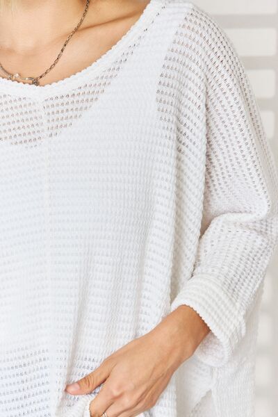 Zenana Full Size Waffle Knit V-Neck Long Sleeve Slit Top in a stylish waffle knit texture, featuring a feminine v-neckline and trendy side slits.