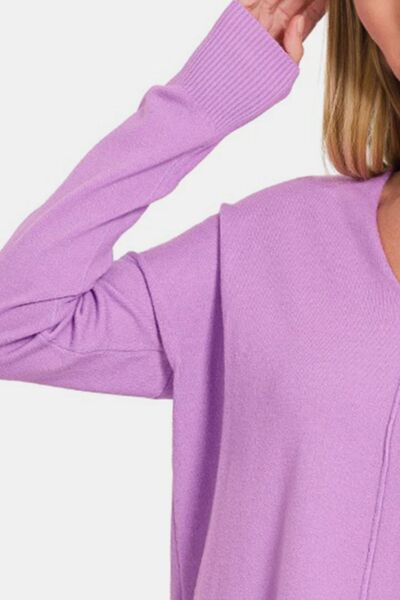 Zenana Slit V-Neck Dropped Shoulder Sweater in a cozy setting, showcasing its stylish slit neckline and relaxed fit.