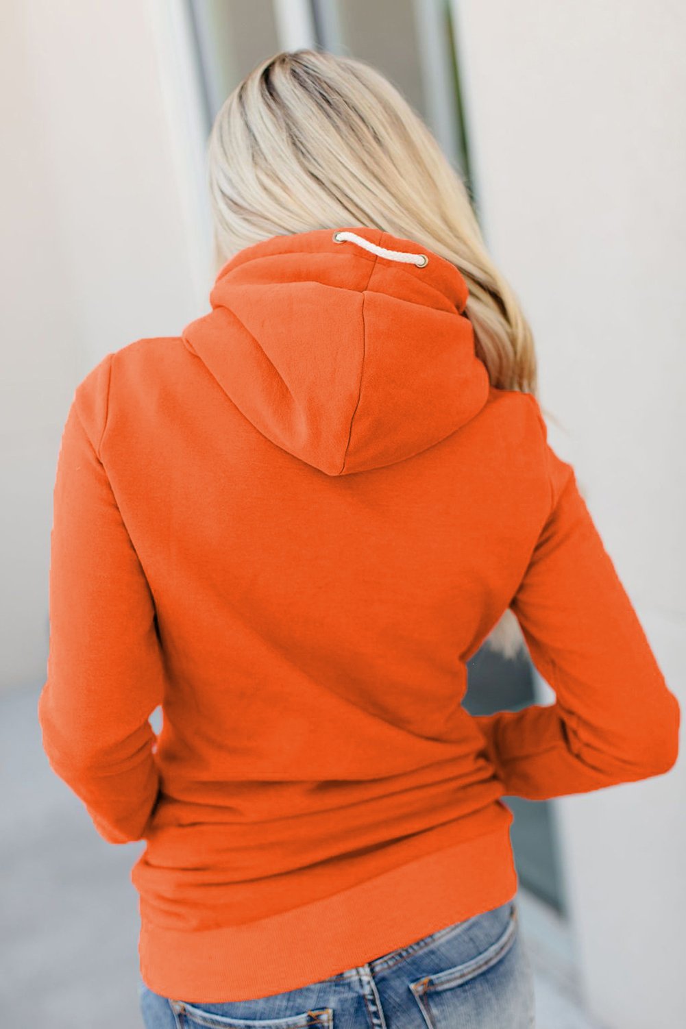 A stylish Zipper Pocket Hoodie in a cozy fabric, featuring a high neckline and ribbed cuffs, perfect for casual wear.