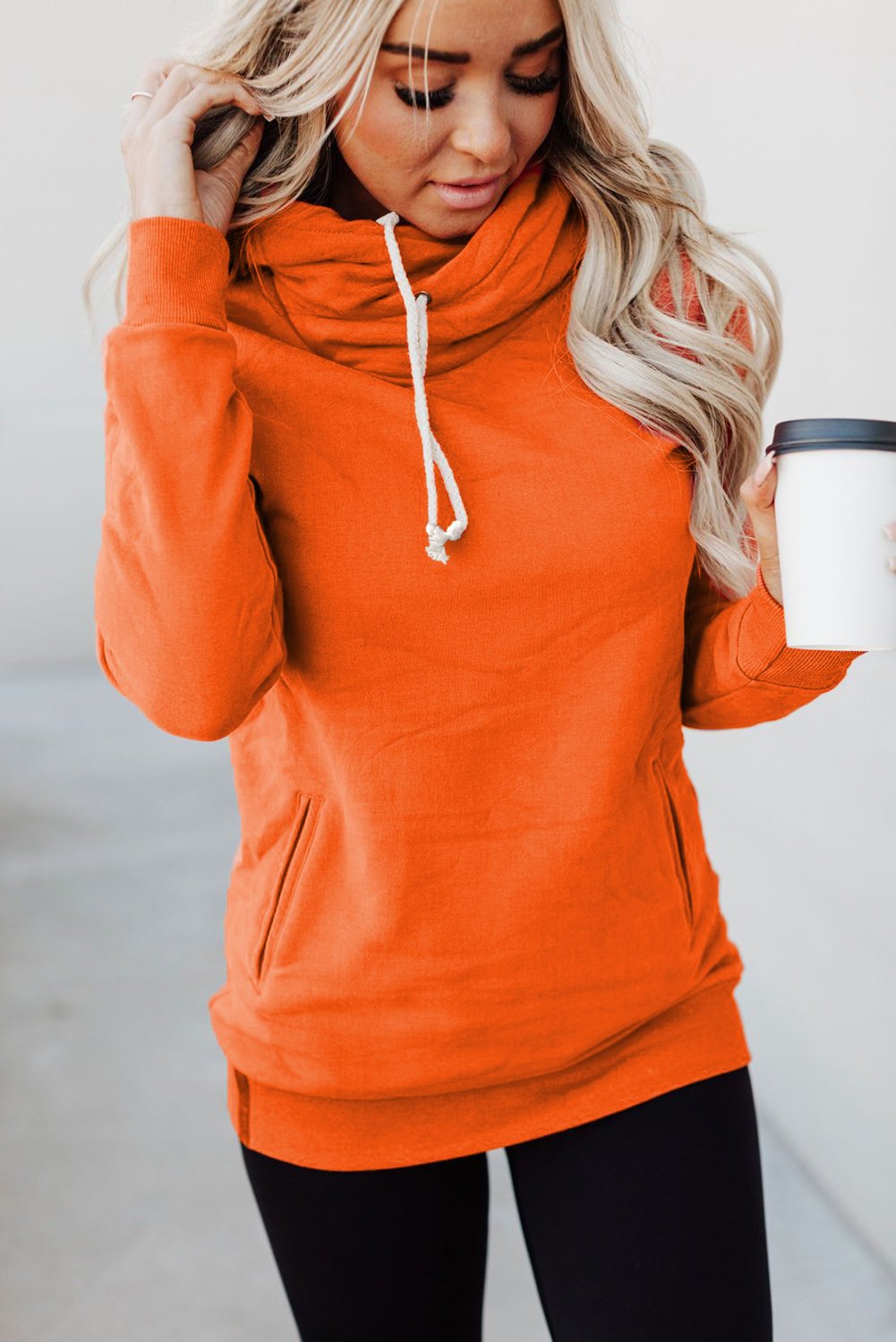 A stylish Zipper Pocket Hoodie in a cozy fabric, featuring a high neckline and ribbed cuffs, perfect for casual wear.