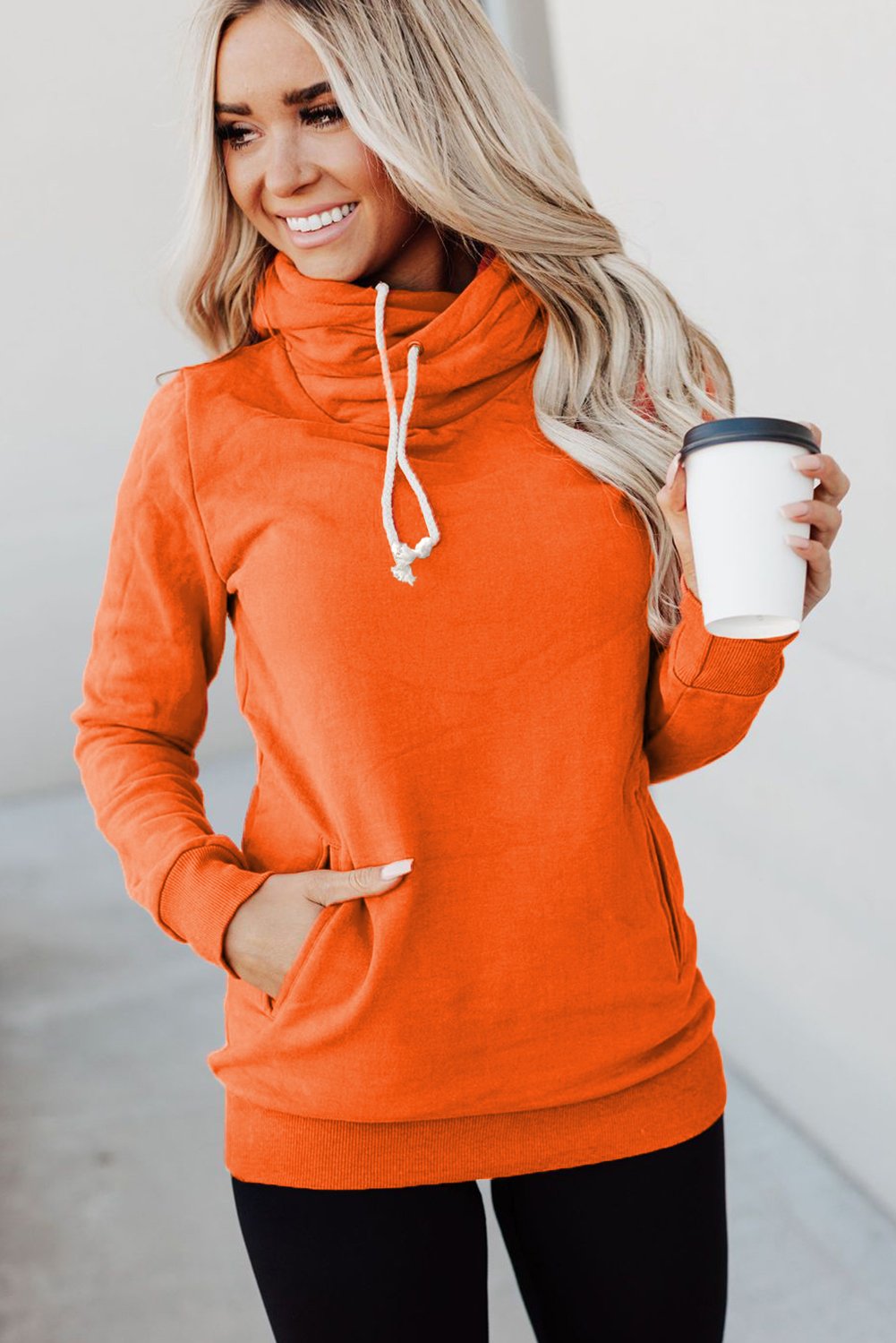 A stylish Zipper Pocket Hoodie in a cozy fabric, featuring a high neckline and ribbed cuffs, perfect for casual wear.