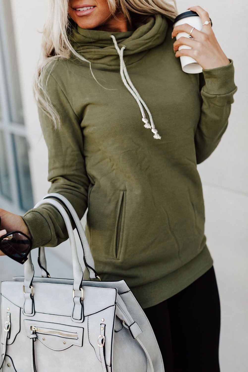 A stylish Zipper Pocket Hoodie in a cozy fabric, featuring a high neckline and ribbed cuffs, perfect for casual wear.