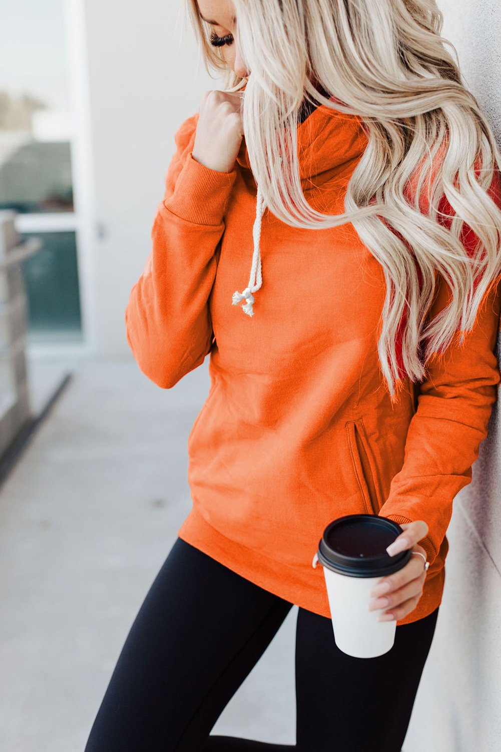 A stylish Zipper Pocket Hoodie in a cozy fabric, featuring a high neckline and ribbed cuffs, perfect for casual wear.