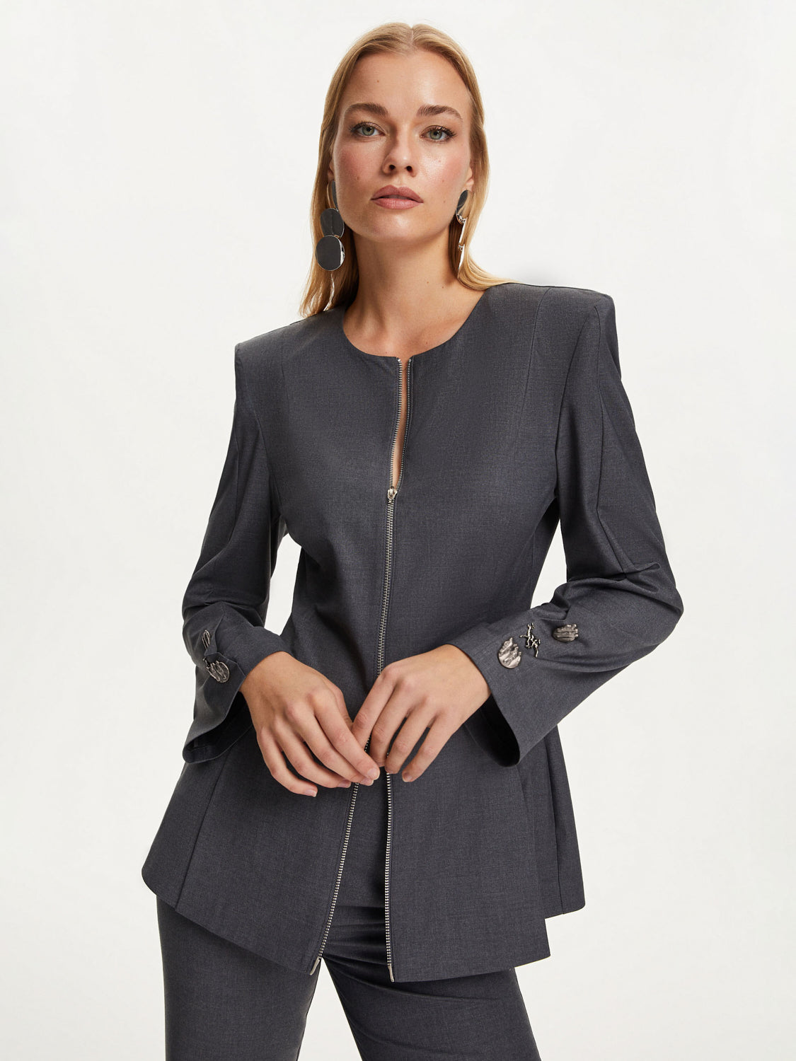 A stylish Zipper Shirt Jacket featuring a roundneck, long sleeves, and unique animal detailed zipper cuffs, perfect for versatile outfits.