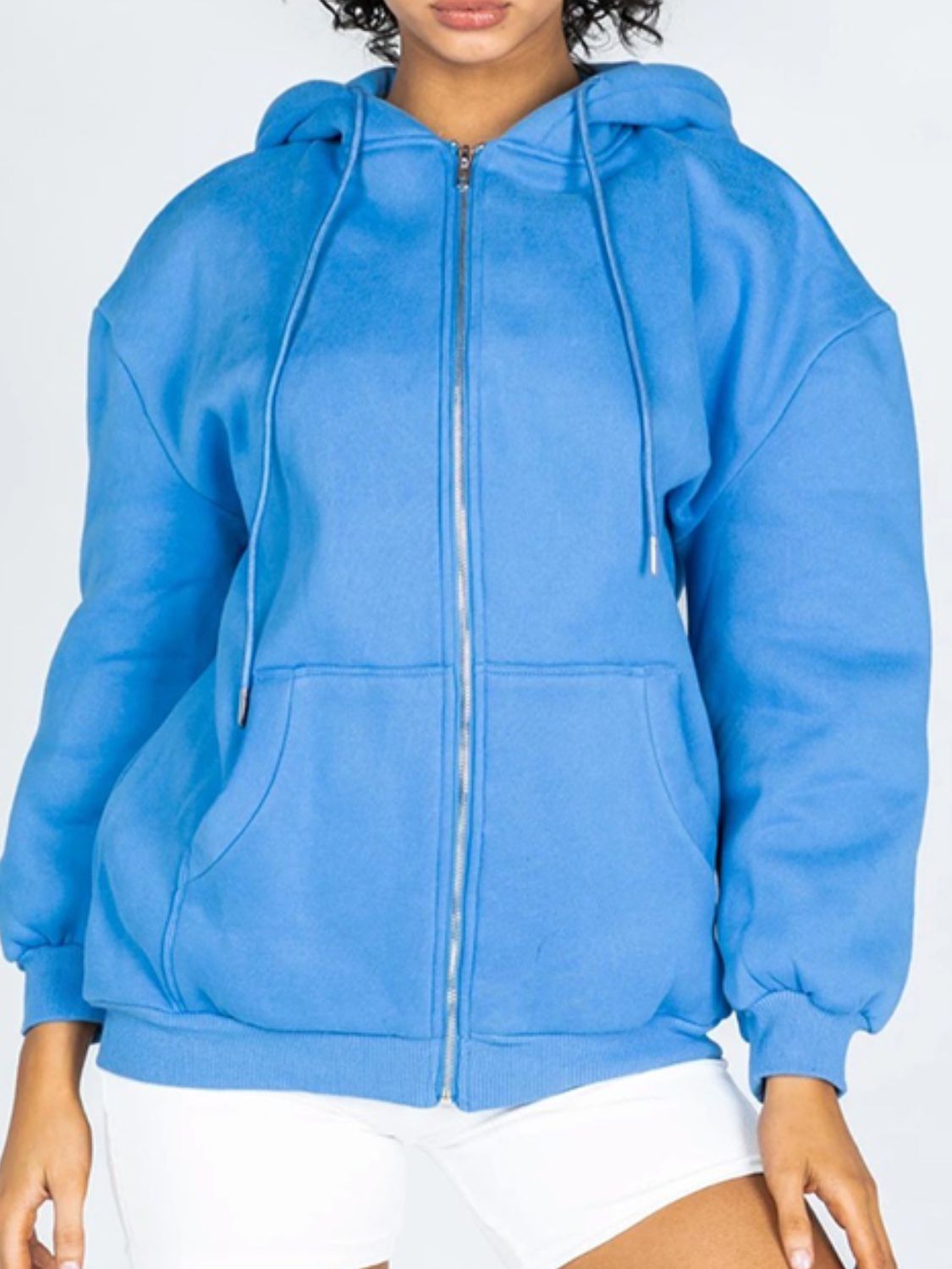 A stylish Zip-Up Drawstring Hoodie in solid color, featuring a hood, long sleeves, and pockets, perfect for casual wear.