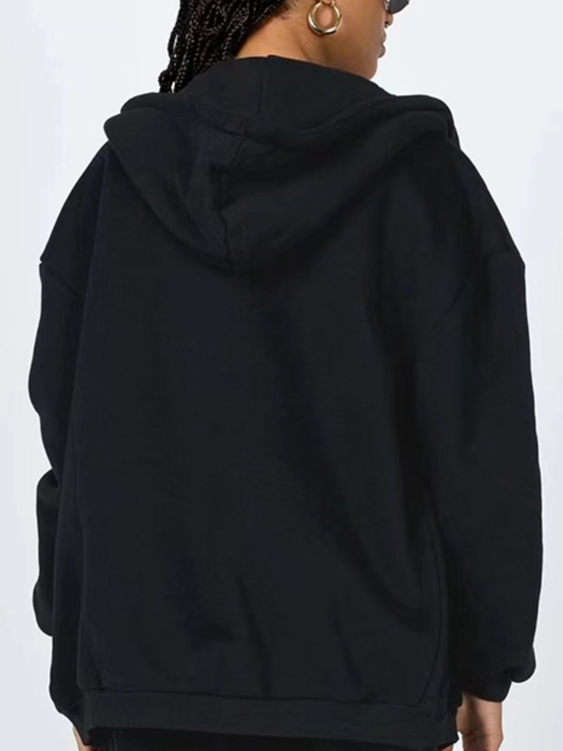 A stylish Zip-Up Drawstring Hoodie in solid color, featuring a hood, long sleeves, and pockets, perfect for casual wear.