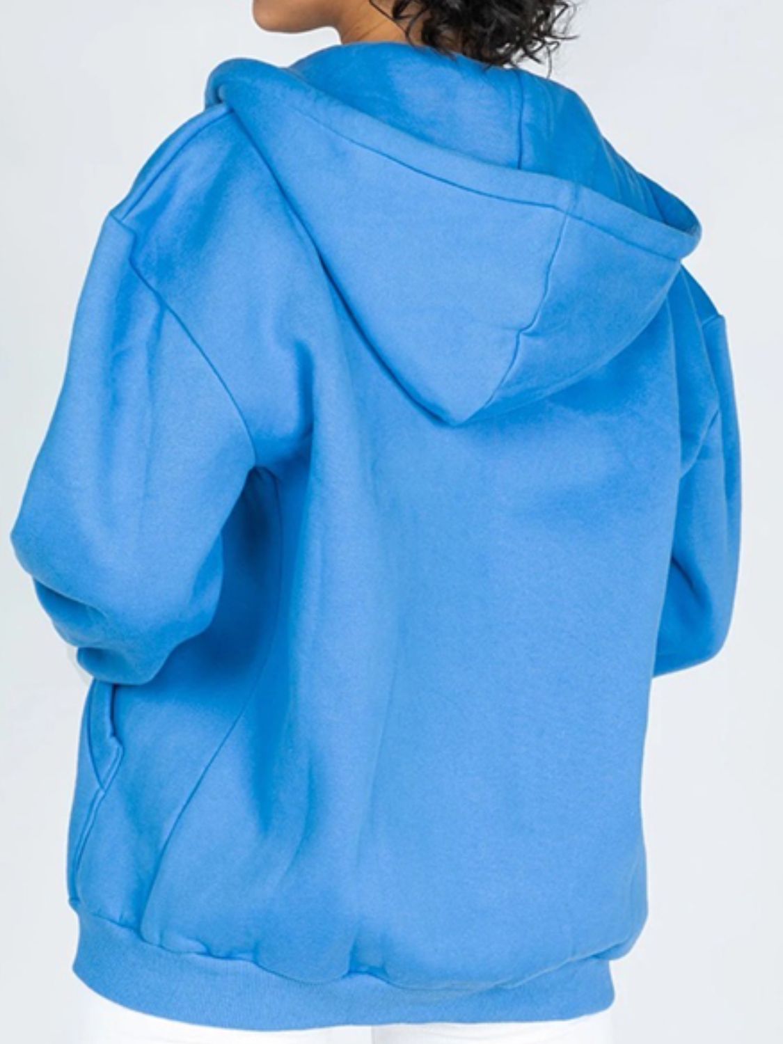 A stylish Zip-Up Drawstring Hoodie in solid color, featuring a hood, long sleeves, and pockets, perfect for casual wear.