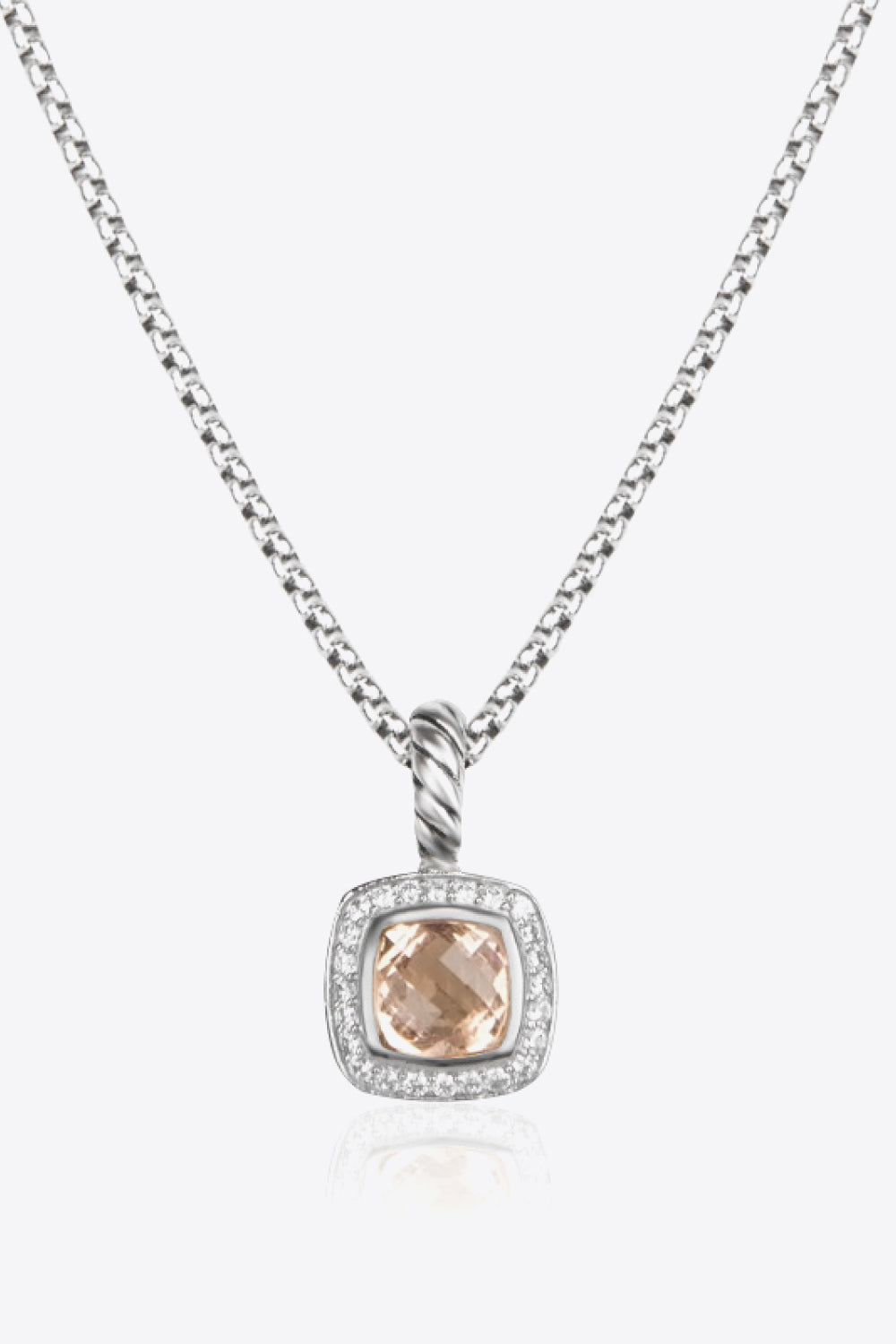 A modern Zircon Pendant Copper Necklace featuring a minimalist design, showcasing a twisted and polished zircon pendant on an 18k platinum-plated chain.