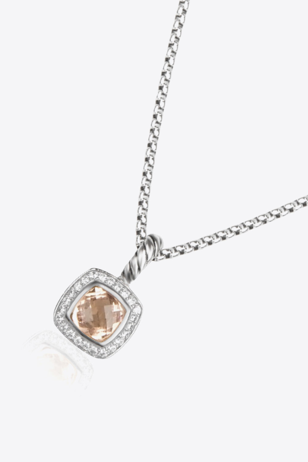 A modern Zircon Pendant Copper Necklace featuring a minimalist design, showcasing a twisted and polished zircon pendant on an 18k platinum-plated chain.