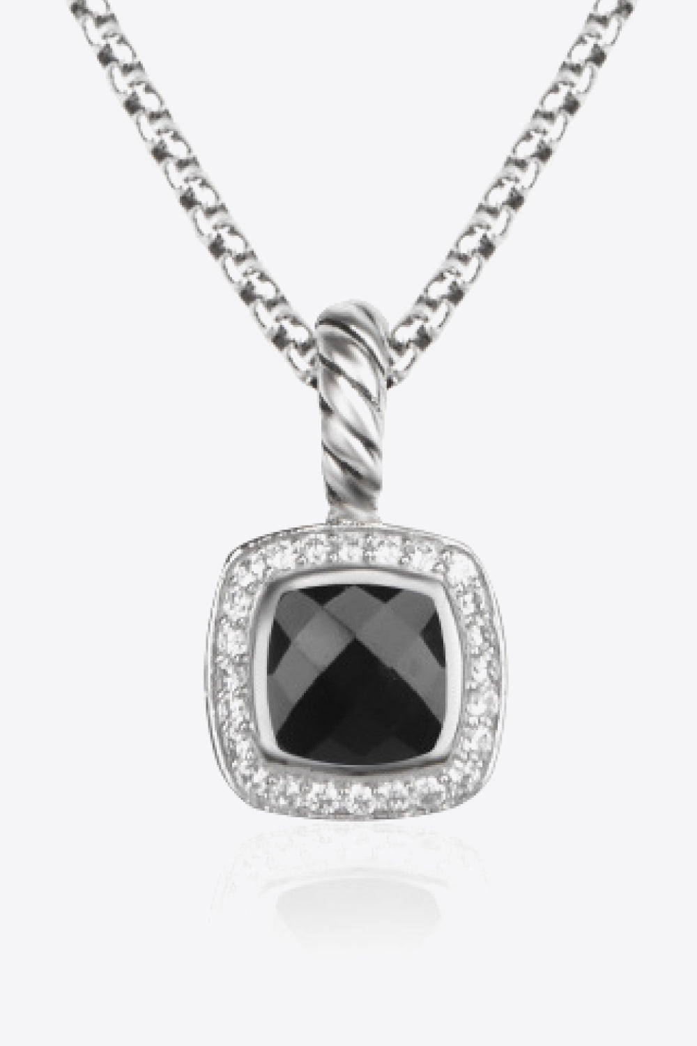 A modern Zircon Pendant Copper Necklace featuring a minimalist design, showcasing a twisted and polished zircon pendant on an 18k platinum-plated chain.