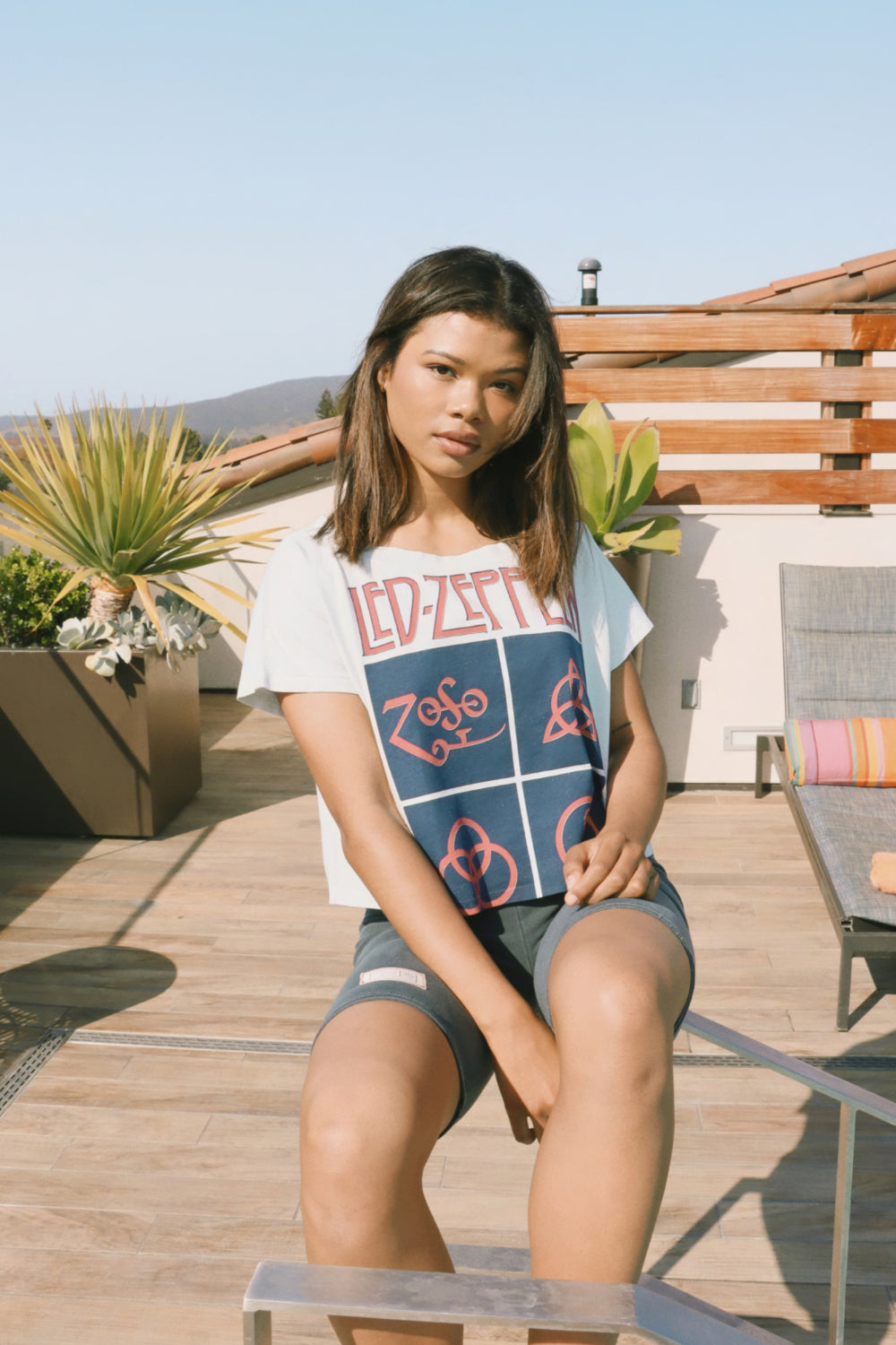 Sky blue Zoso Led Zeppelin crop tee featuring iconic symbols, made from 100% organic cotton.